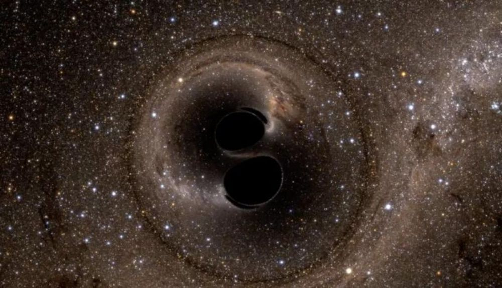 Simulación de colisión de dos agujeros negros en espiral. Simulación de colisión de dos agujeros negros en espiral.