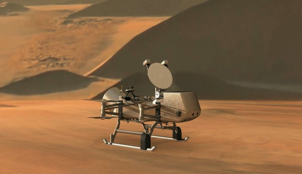 Esta ilustración muestra el helicóptero de aterrizaje Dragonfly de la NASA, acercándose a un sitio en la exótica luna de Saturno, Titán.